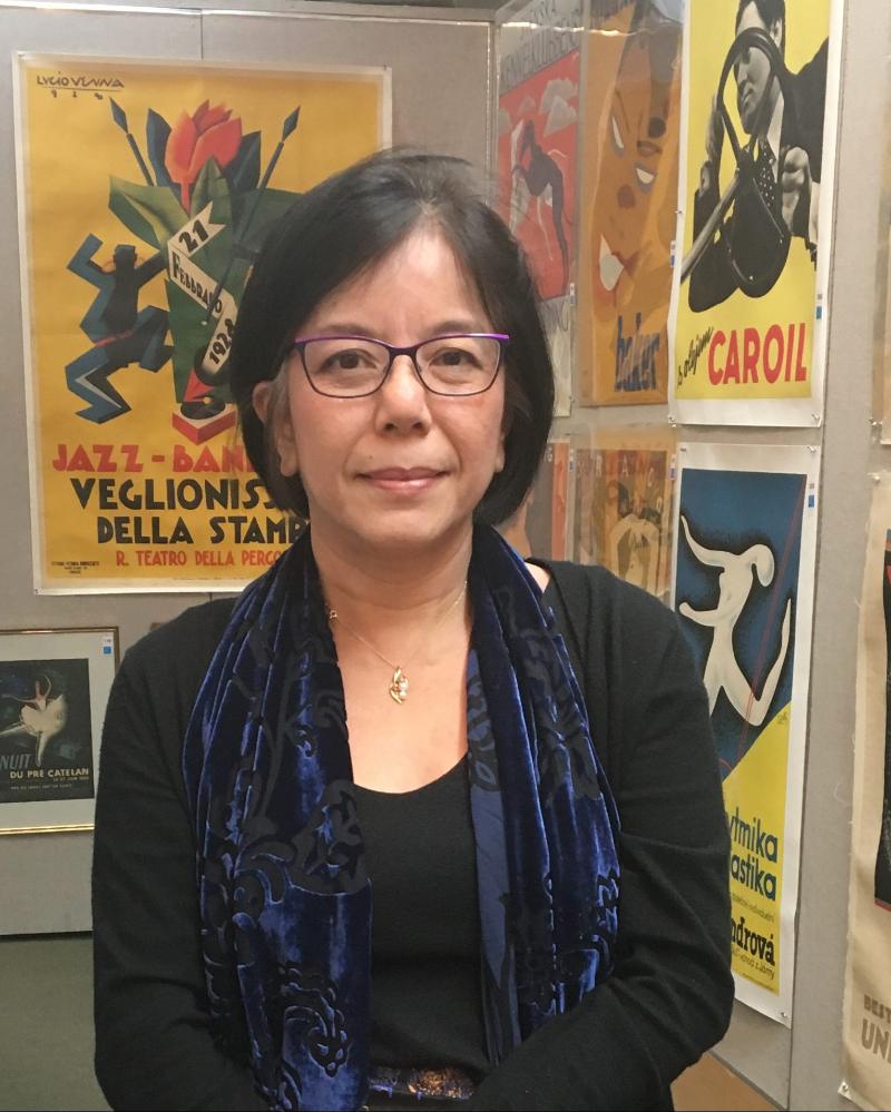 Nancy Rao standing in front of art on a wall